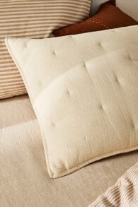 Striped muslin cushion cover