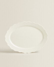 Earthenware serving dish with raised-design edge