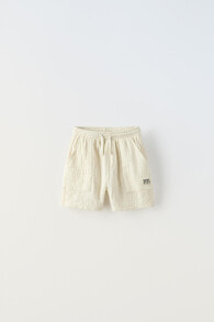 Crepe bermuda shorts with label