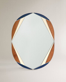 Wall mirror with irregular enamel frame