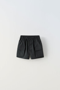 Technical bermuda shorts with pockets