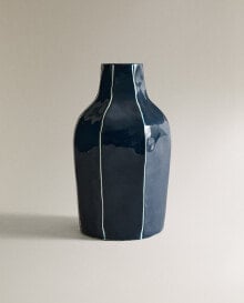 Metal vase with irregular stripes