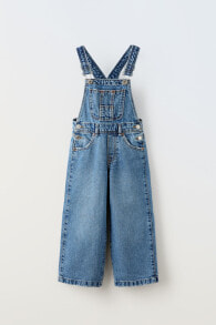 Wide-leg dungarees with buckled straps