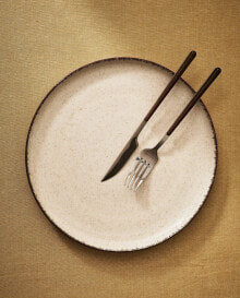 Porcelain dinner plate with antique finish rim