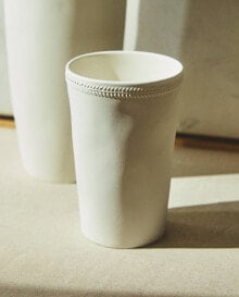 Ceramic toothbrush holder with border detail