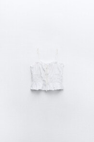 Top with cutwork embroidery and bows