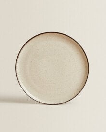 Porcelain dinner plate with antique finish rim