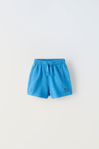 Plush bermuda shorts with label detail