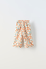 Orange print textured trousers