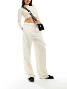 Купить женские футболки и топы EDITED: Edited tailored pocket trousers in cream