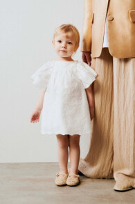 Dresses and sliders for newborns