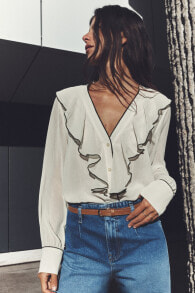 Ruffled blouse with contrast piping