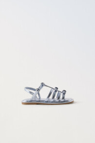 Metallic sandals with bows