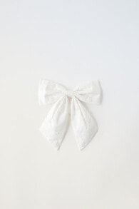Hair tie with faux pearls and bow