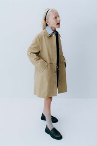 Trench coat with snap buttons