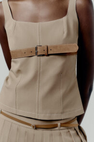 Top with belt and topstitching