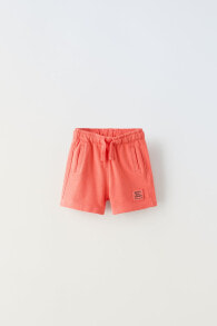 Plush bermuda shorts with label detail