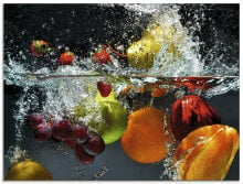 Glasbild Spritzendes Obst auf dem Wasser