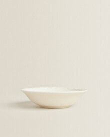 Earthenware bowl with raised-design edge