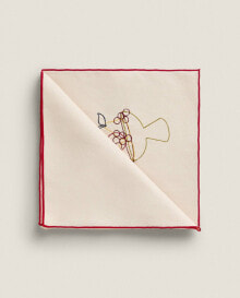 Napkin with embroidered objects