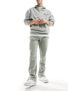 Купить мужские брюки The Couture Club: The Couture Club emblem joggers in khaki