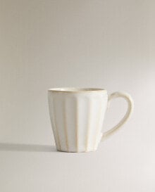 Espresso cup with raised design