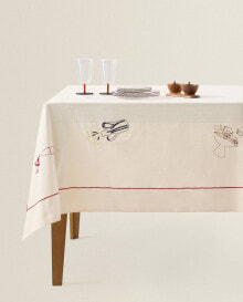 Tablecloth with embroidered objects