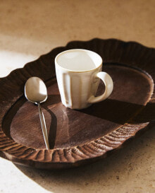 Espresso cup with raised design