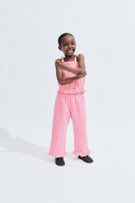 Gingham trousers with small ruffles