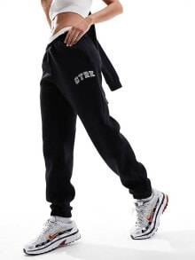 Купить женские брюки The Couture Club: The Couture Club varsity relaxed joggers in black