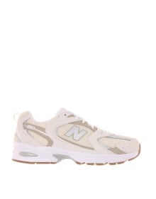 New Balance 530 trainers in beige купить в аутлете