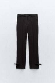 Trousers with bows on the hem