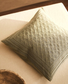 Cushion cover with raised design