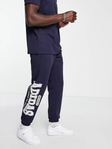 Мужские спортивные костюмы adidas Originals &#039;Preppy Varsity&#039; large logo oversized joggers in dark navy
