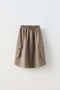 Cargo skirt with combined pockets