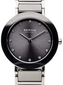 Женские наручные кварцевые часы Bering  сталь с керамическими вставками,  циферблат украшен кристаллами Swarovski.