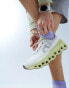 ON Cloudmonster running trainers in white and yellow