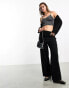 Фото #1 товара Monki skirt layer flare trousers in black