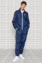 Фото #1 товара Спортивный костюм Nike Hoxton свободного кроя с манжетами из льняной ткани синего цвета