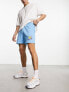 ASOS DESIGN oversized shorts in blue with cartoon print