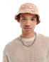 ASOS DESIGN crochet bucket hat with stripe in orange and ecru