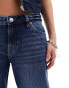 Фото #4 товара Monki Kiri low waist loose fit flared jeans in dark blue wash