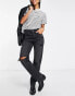 Фото #1 товара Stradivarius straight leg jean with rip in black