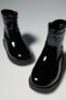 Patent finish stretch boots