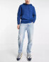 Topman tapered curved leg jeans in light wash blue