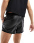 ASOS DESIGN slim pleated leather look shorts in black