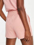 Puma Training shorts with mesh pockets in pink micro print