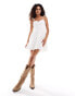 Фото #1 товара Daisy Street cami mini flippy dress with rosette detail in white broiderie