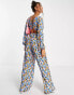 Фото #4 товара ASOS DESIGN bubble crepe button back long sleeve jumpsuit in blue floral