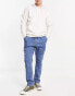 Фото #1 товара ASOS DESIGN pull on cargo jeans with cuffed hem in mid blue wash